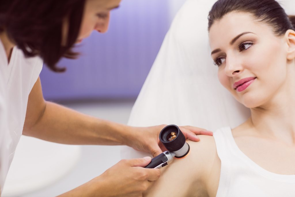 dermatologist examining